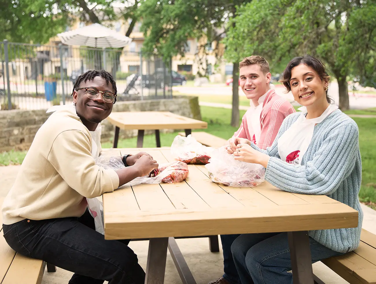 group of young adults eating lunch