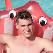 young man relaxing on a floaty